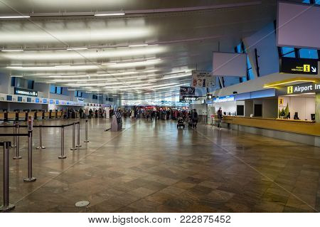 Vienna, Austria - December 2017: Vienna Schwechat Airtport Terminal 1 check-in counter area. Vienna Airport is the largest airport in Austria and a major hub airport in the region.