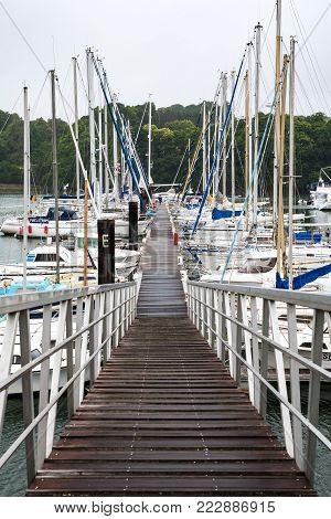 TREGUIER, FRANCE - JULY 2, 2010: pier in marina of Treguier town on Jaudy river . Treguier is port town in the Cotes-d'Armor department in Brittany.