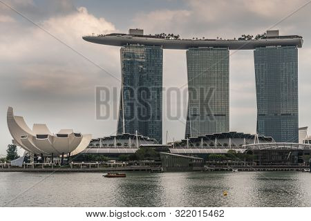 Singapore - March 20, 2019: Marina Bay Sands Hotel And Casino With Its Three Towers Seen From Behind