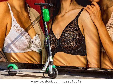 Bucharest, Romania - September 09, 2019: A Lime-s Electric Scooter Is Parked On A Sidewalk In Front 