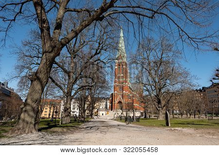 The Neogothic Johannes Kyrka (st Johns Church) In Stockholm, Sweden In A Park Where People Can Walk 