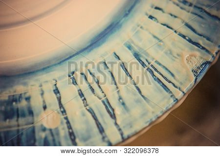 The Edge Of The Pottery Wheel With Current Streaks Of White Clay