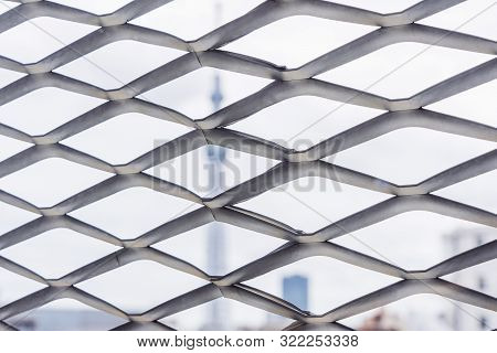 Close-up View Of Expanded Metal Mesh Panels And Blurred Background.