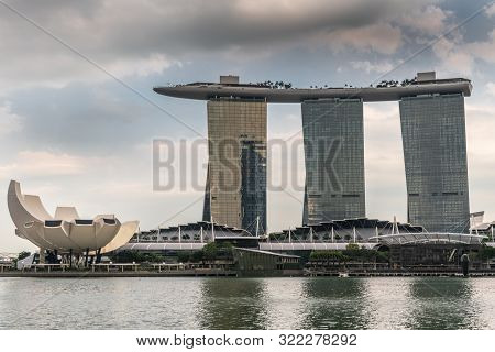 Singapore - March 20, 2019: Marina Bay Sands Hotel And Casino With Its Three Towers Seen From Behind