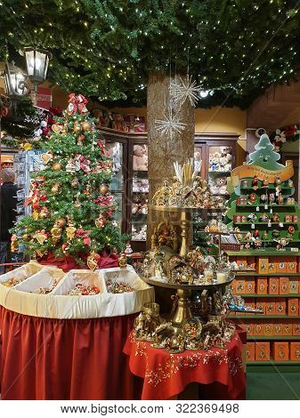 Heidelberg, Germany - August 7, 2019: Christmas Tree And Other Decorations And Articles Sells  Throu