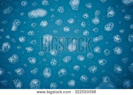 foam spots on blue water
