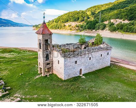 Ruins Of Not Flooded Old Mavrovo Church In Summer By Mavrovo Lake In North Macedonia