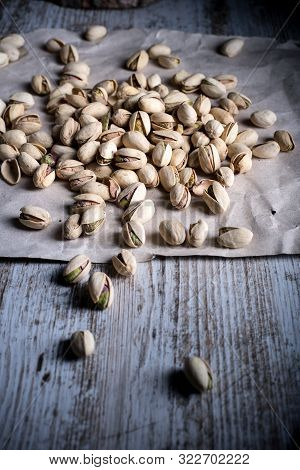 Still Life Of Isolated Pistachios In The Foreground In Studio.