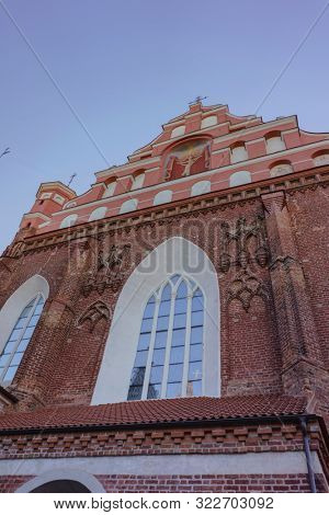 VILNIUS, LITHUANIA - JULY 30, 2019:  Facade of Roman Catholic Church of St. Anna in Vilnius (lit. Church of the Holy Onos) and  Church Of St. Francis And St. Bernard, Details, UNESCO World Heritage
