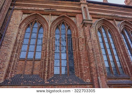 VILNIUS, LITHUANIA - JULY 30, 2019:  Facade of Roman Catholic Church of St. Anna in Vilnius (lit. Church of the Holy Onos) and  Church Of St. Francis And St. Bernard, Details, UNESCO World Heritage