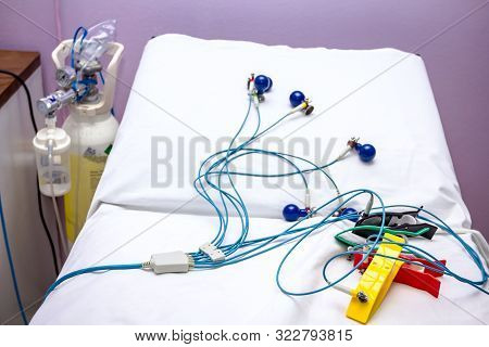 Ecg Or Ekg Electrodes For Electrocardiogram Records Patient Heartbeats On Bed In Hospital.