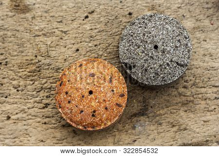 Round Briquettes Of Pressed Flax Seed And Sunflower Seed. It Is Used As Feed For Animals, Birds And 