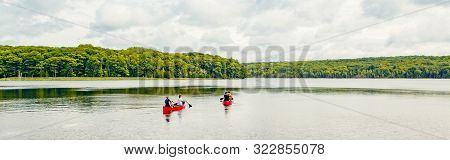 Canada Forest Park Nature With Family Friends Riding In Red Kayaks Canoe Boats In Water. Beautiful L