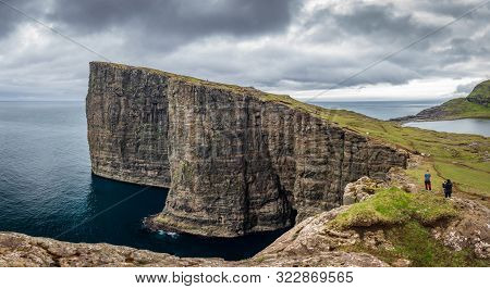 Sorvagsvatn Lake Over The Ocean Spectacular Panorama With Tourists