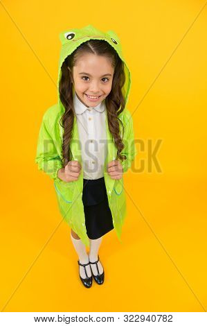 Frog Style. Schoolgirl Hooded Raincoat Enjoy Fall Weather. Rainproof Accessories Make Rainy Fall Day