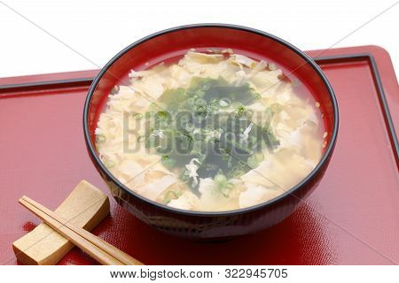 Japanese Foof, Kakitama Egg Soup In A Wooden Bowl On Black Tray　