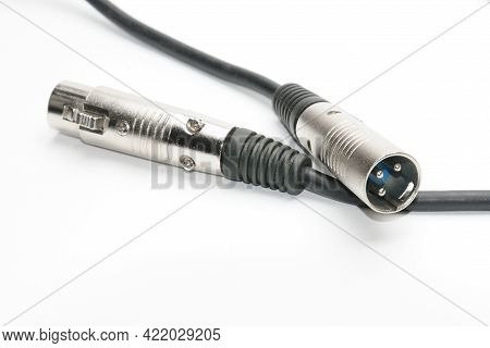 Audio Cable With Xlr Connectors For Microphones And Professional Audio Equipment On A White Backgrou