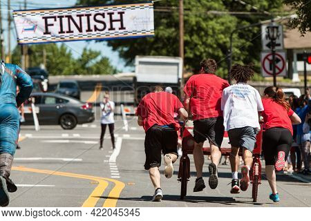 Lawrenceville, Ga/usa - April 27:  A Team Pushes A Teammate Lying On A Homemade Bed Towards The Fini
