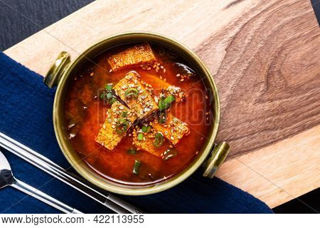 Food Concept Korean Spicy Tofu Soup On Wooden Board With Copy Space
