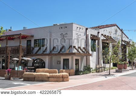 SAN JUAN CAPISTRANO, CALIFORNIA - 27 MAY 2021: Five Vines Wine Bar and Mayfield Restaurant and Marketplace on Verdugo Street in the Historic Downtown District.