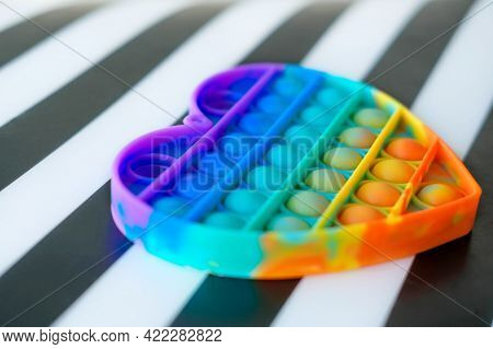 Rainbow Push Bubble Fidget Sensory Toy Pop It In The Shape Of A Heart. Washable And Reusable Silicon