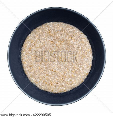 Top View Of Cooked Porridge From Wheat Groats (crushed Partly Hulled Wheat Grains) In Gray Bowl Isol