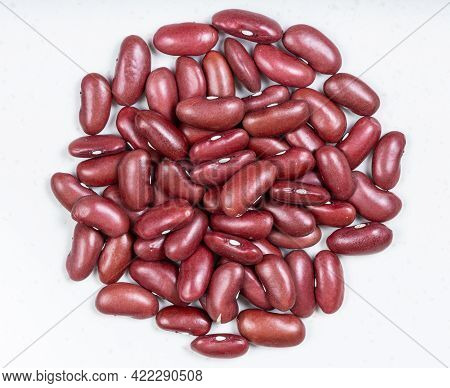 Top View Of Pile Of Raw Kidney Beans Close Up On Gray Ceramic Plate