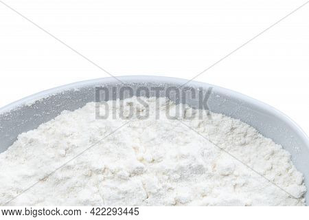 Top View Of Part Of Round Bowl With Wheat Flour Isolated On White Background