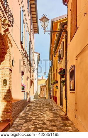 Old italian street in Santarcangelo di Romagna town on sunny day, Rinini Province, Emilia-Romagna, Italy. Cityscape