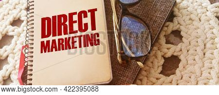 Direct Marketing Words On Coer Of Notebook, Glasses And Pen. Business Concept