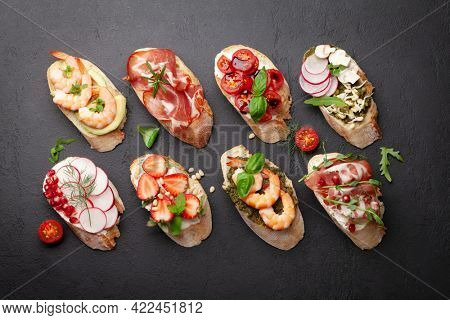 Appetizers board with traditional spanish tapas set. Italian antipasti bruschetta snacks. Top view flat lay