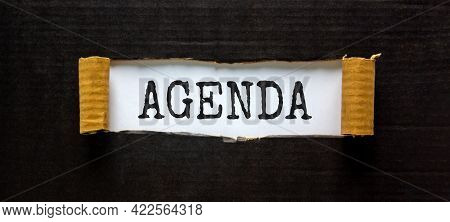 Business And Agenda Symbol. The Concept Word 'agenda' Appearing Behind Torn Black Paper. Beautiful B
