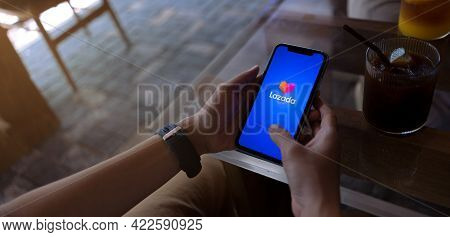 Chiang Mai, Thailand, May 26, 2021 Young Woman Online Shopping By Lazada App On Iphone Xi At The Cof