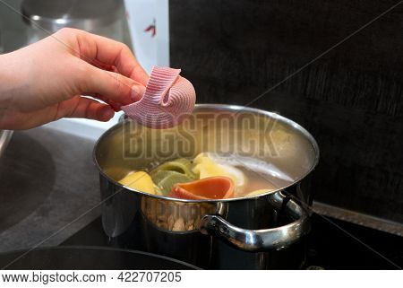 The Process Of Cooking Italian Multicolored Pasta In A Saucepan