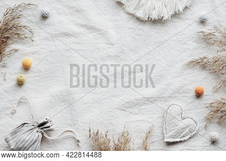 Textile Flat Lay With Dry Reeds, Pampas Grass And Macrame. Bag With Fragrant Herbs And Soft Cotton H