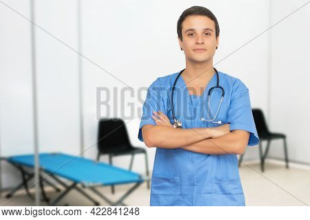 Optimistic American Male Nurse At Vaccination Station Is Ready For Vacinating Patients Against Coron