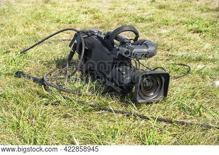 Professional Camcorder In A Grass