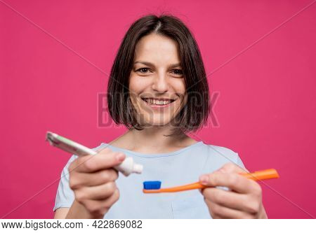 Beautiful Happy Young Woman With Toothbrush On Blank Pink Background