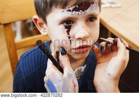 Little Cute Child Making Facepaint On Birthday Party, Zombie Apocalypse Facepainting, Halloween Prep