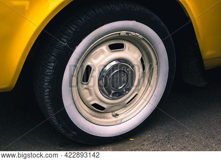 Retro Car Festival. Tire Of An Old Retro Car. Fragment Of The Front Of A Retro Car. The Old Car Has 