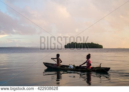 Marovo Lagoon, Solomon Islands - June 5, 2015: Children On The Way To School With A Canoe During Sun