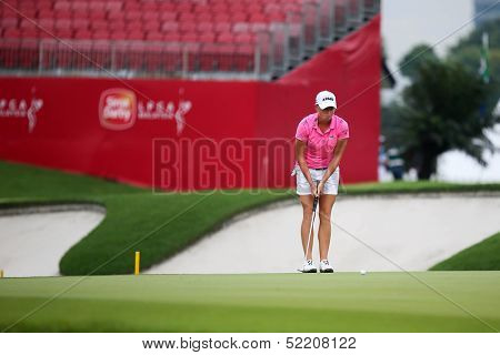 KUALA LUMPUR - OCTOBER 12: Stacy Lewis of USA putts on the 2nd hole green on Day 3 of the Sime Darby LPGA at the Kuala Lumpur Golf & Country Club on October 12, 2013 in Kuala Lumpur, Malaysia.