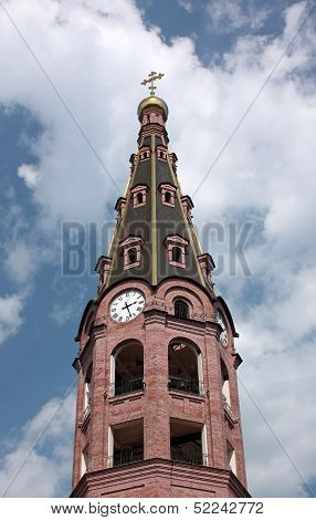Bell tower with a clock. Holy Trinity Monastery. Russia