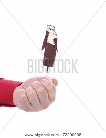 Hand holds chocolate ice cream.