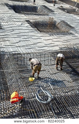 HOFHEIM, GERMANY - JULY 4, 2011: workers are doing the armoring at the building site to stabilize the fundament
