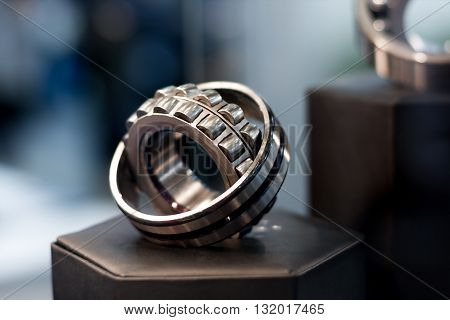 Metal cylindrical bearing for heavy industry with bokeh background