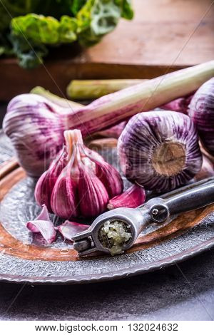 Garlic. Fresh garlic. Red garlic. Garlic press. Violet garlic.Garlic background. garlic bulbs.