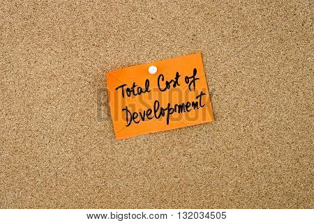 Tcd As Total Cost Of Development Written On Orange Paper Note
