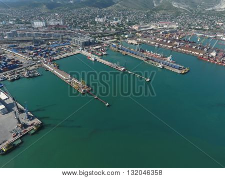 Industrial Seaport, Top View. Port Cranes And Cargo Ships And Barges.