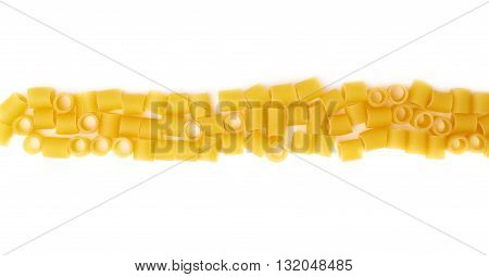 Line made of dry ditalini yellow pasta over isolated white background